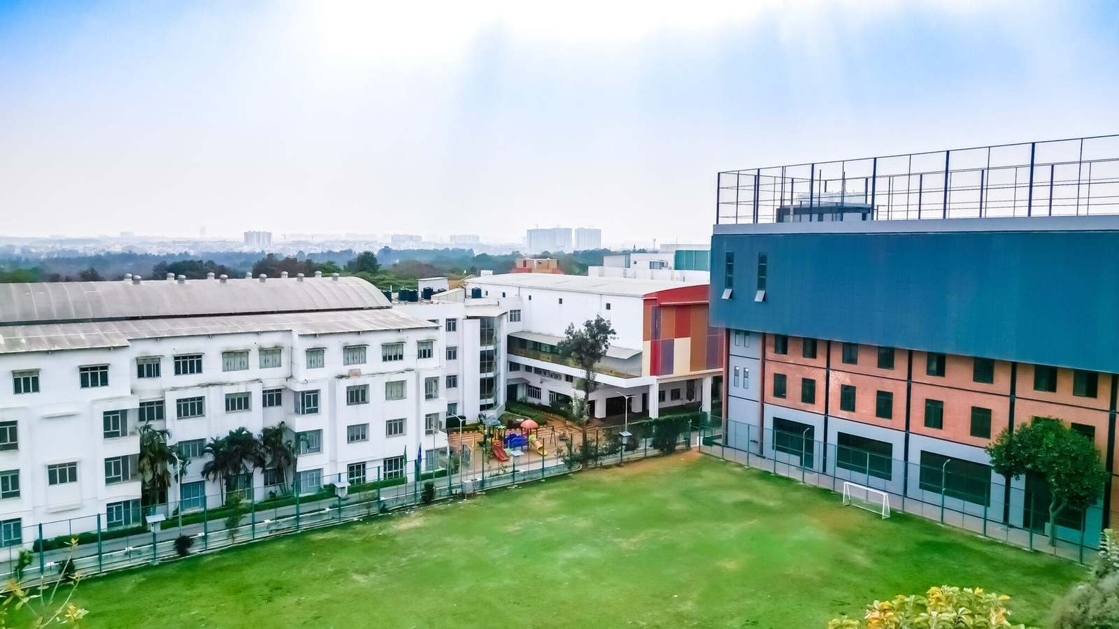 Aerial view of the green Harvest International School campus on Sarjapur Road